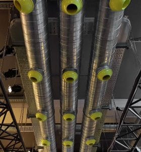 Green KAM-D Nozzle Jet Diffusers mounted on duct in a bar with high ceiling